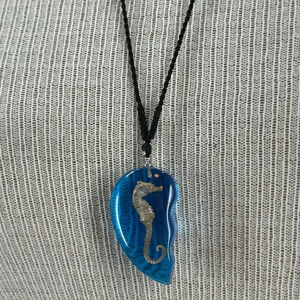 Seahorse blue resin half heart necklace